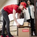 full-shot-delivery-woman-with-boxes-scaled.jpg