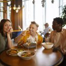 group-friends-having-lunch-together-restaurant-scaled.jpg