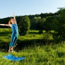 red-woman-practicing-fitness-yoga-outdoors-scaled.jpg